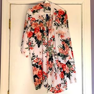 Brand new floral cover to wear over a top tags still on, never worn.